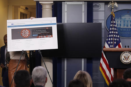 A coronavirus poster at White House press briefing