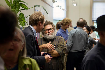Crosscut Editor-at-Large Knute Berger speaks to guests at a Crosscut gathering in its former office