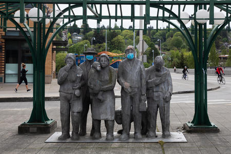 "Waiting for the Interurban" statue with faces masks added on
