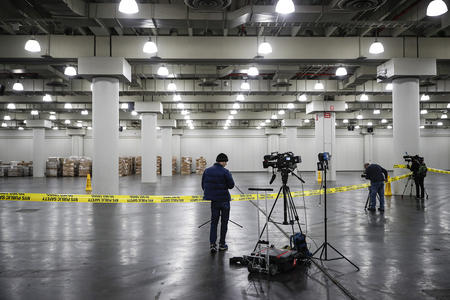 Video journalist in empty garage