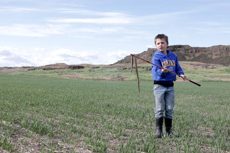Boy in a farming field