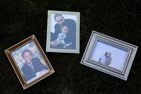 Three framed photographs of Leonard Thomas who was killed by the Pierce County Metro SWAT team in 2013