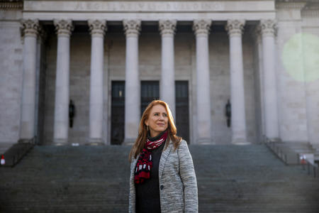 Kim Wyman stands in front of the steps and columns of the state Legislative Building