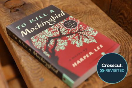 A copy of Harper Lee's "To Kill A Mockingbird" sits on a table. 