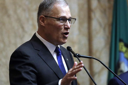 Gov. Jay Inslee speaks during his annual state of the state address before a joint legislative session on Jan. 9, 2018, in Olympia. (AP Photo/Elaine Thompson)