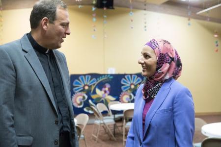 Aneelah Afzali and Rev. Terry Kyllo talk while standing in St. Paul's Episcopal Church in Mt. Vernon.