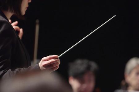A conductor with a baton