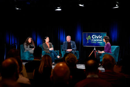 Three women and a man sitting on stage at Seattle' Civic Cocktail event