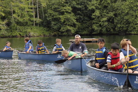 campers in canoes