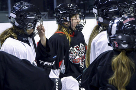 girls playing hockey