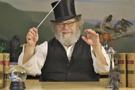Host Knute Berger "conducts" with baton and top hat.