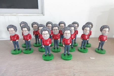 Three rows of Mossback bobbleheads