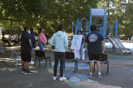 activists stand around in a park