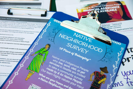 Surveys and information flyers line the table at the Indigenous Vendors Market 