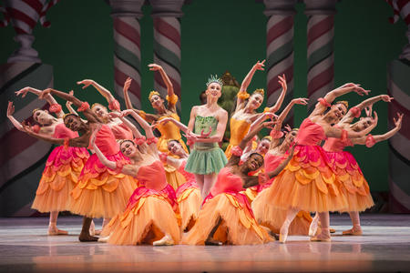 photo of a stage full of brightly costumed ballerinas performing the Nutcracker