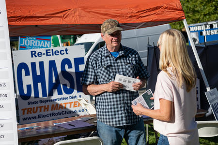 Rob Chase speaks with a voter