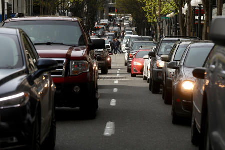 Cars sit in traffic on 5th Avenue in downtown Seattle, April 19.