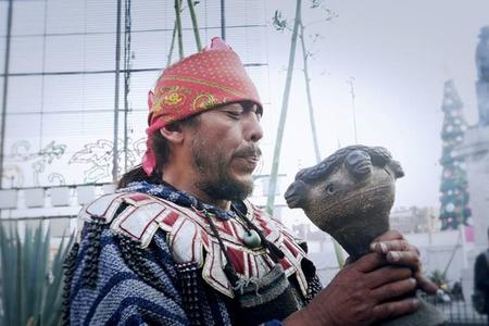 Aztec shaman blowing incense 