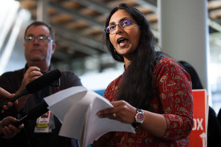 Councilmember Kshama Sawant speaks to press during a rally to protest proposed development at the site of the Showbox Market on Wednesday, Aug. 1, 2018, at Seattle City Hall in Seattle, Wash. (Jovelle Tamayo for Crosscut)