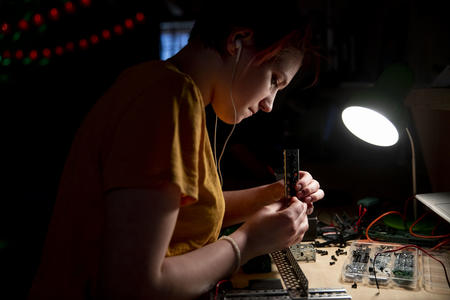 High school freshman Elly Pollock works on her robot during a Nerdy Girls meetup in Ellensburg on May 17, 2019.