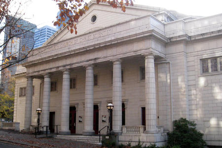 photo of a neoclassical white building with five columns across the portico