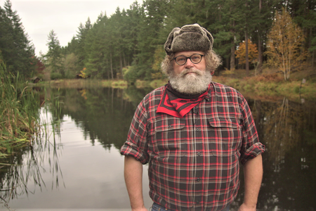Host Knute Berger stands in front of Ayer Pond, on Orcas Island