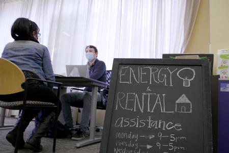 Sponsored | Two people talk about rental and energy assistance at Byrd Barr Place