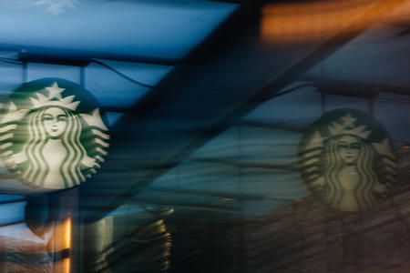 a motion blurred Starbucks sign