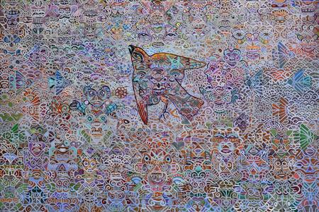 a painting of a bird surrounded by many tiny hidden faces