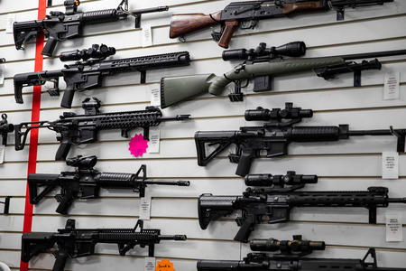 A photo of long guns on the wall of a Bellevue, WA, gun range.