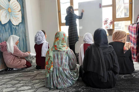A teacher leads a lesson in Afghanistan