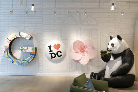 An art installation featuring a large “I (heart) DC” pin and a panda bear sculpture