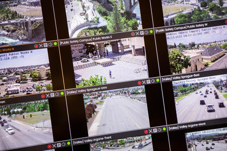 More than a dozen video frames show various scenes from surveillance cameras in angled rows.