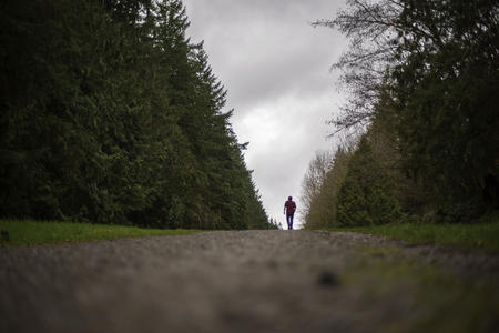 Nathan Lambrecht walks along a trail in Woodinville, Washington,