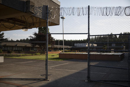 A fence topped with barbed wire at the Womens Corrections Center for Women.