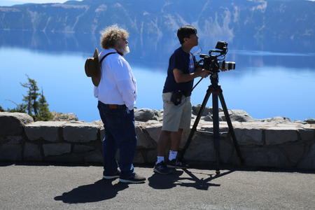 Knute Berger and videographer Resti Bagcal look off to get a shot for Mossback's Northwest's 8th season. 
