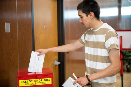 Yakima resident Jordan Chavez turns in his ballot