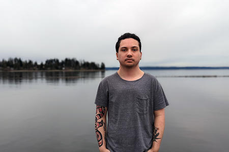 Andres “Dre” Thornock, 23 stands in front of the Tulalip Marina.