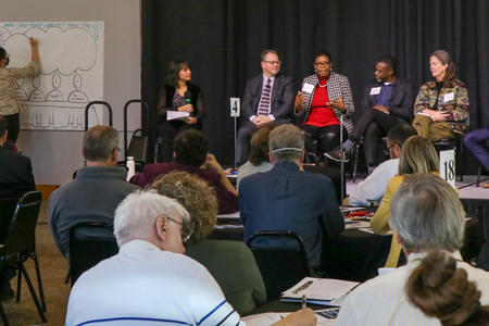 A picture of panelists at the Civic Health Summit in October discuss bridging political divides.
