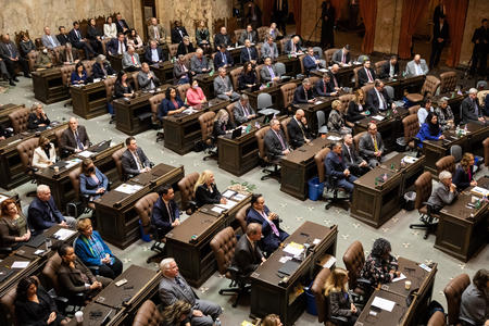Washington state legislators listen to Gov. Jay Inslee’s “State of the State” at the Washington State Capitol 