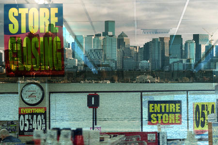 photo illustration of a Bartells storefront and the Seattle skyline.
