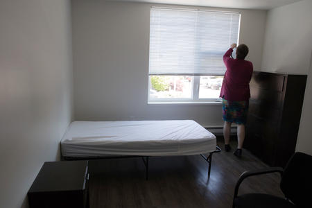 A woman in a room for homeless youth at Cocoon House