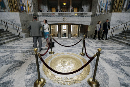 The Washington state seal is protected by ropes in the rotunda of the Legislative Building